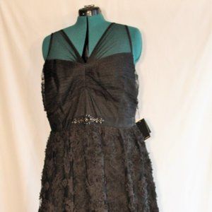 Sleeveless tulle shirred bodice ball gown with petal skirt